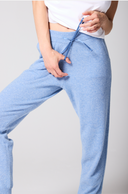 Model wearing Chambray Blue Cashmere Cuffed Ankle Joggers, fabric and design detail