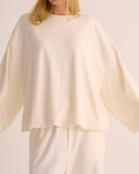 Mamu ivory cloud soft sweatshirt with tucked hem. 